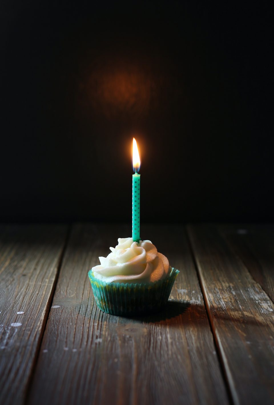 taper candle on cupcake