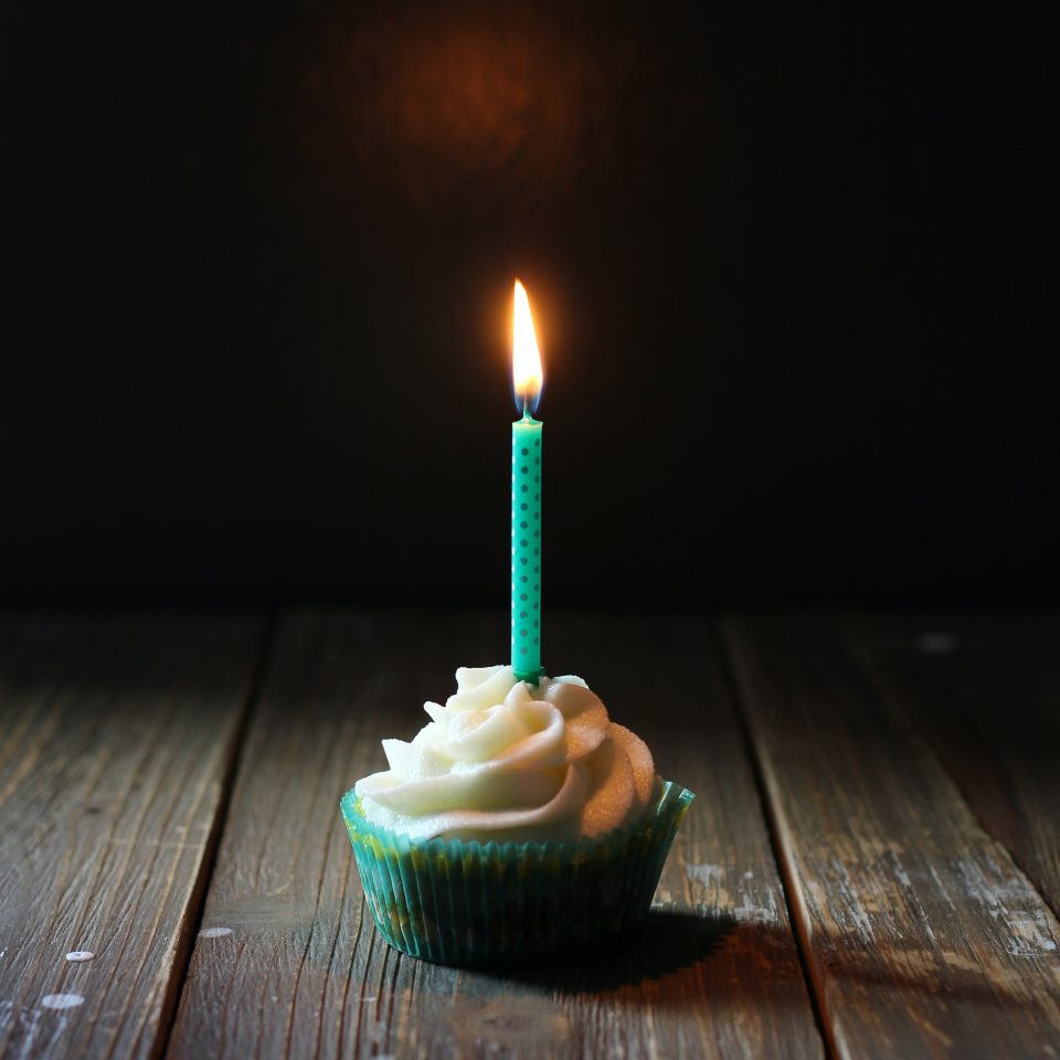 taper candle on cupcake